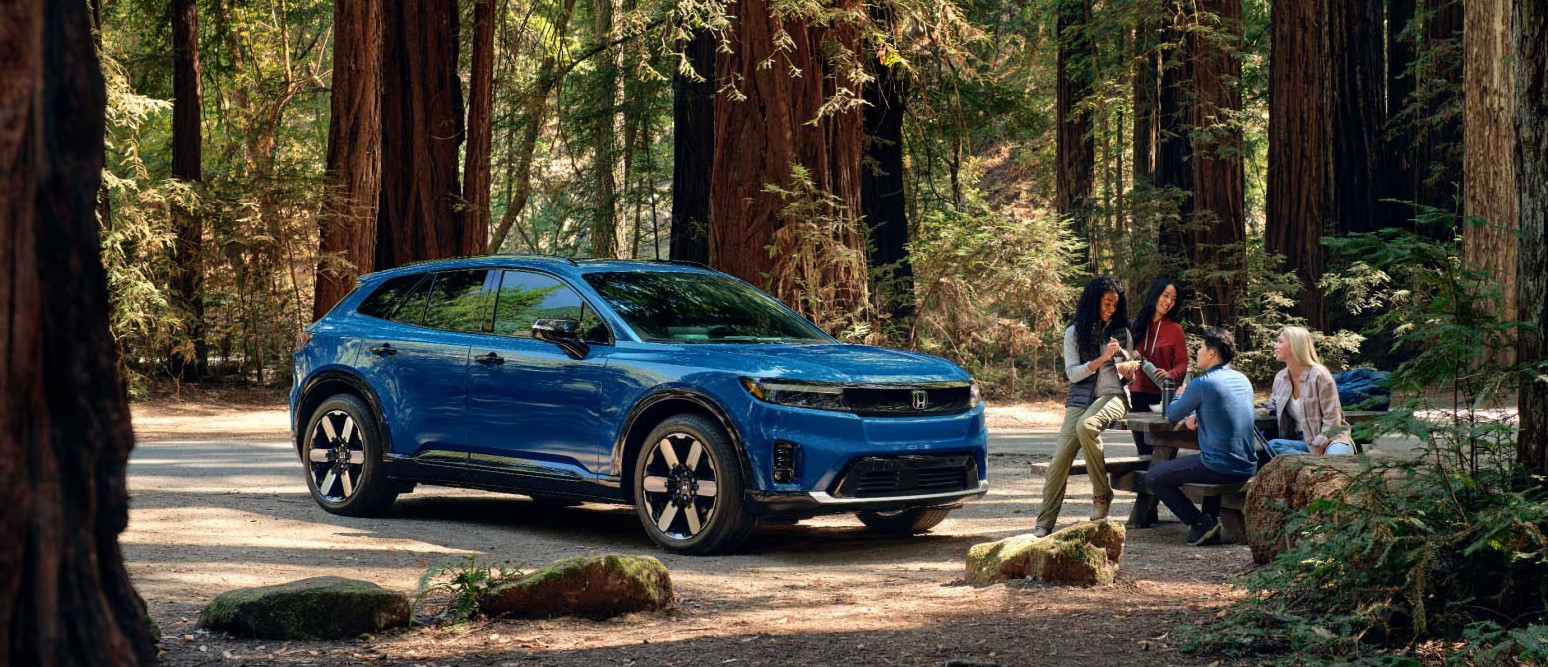 Honda Prologue driving on a scenic road